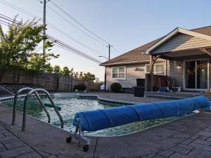 a pool with a blue tube in a backyard at Full Kitchen AC Share Bathroom #2 in Halifax