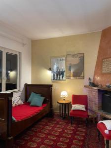 a bedroom with a bed and a table and a chair at Villino Luce in Nettuno