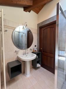 a bathroom with a sink and a mirror at B&B Piccolo Relais in Lessolo +109 photos