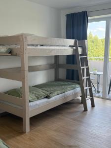 Ένα ή περισσότερα κρεβάτια σε δωμάτιο στο 2Zi Apartment in Schloss Neuhaus mit Ladestation für Elektroautos