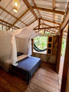 Una cama o camas en una habitación de Casa Caimito