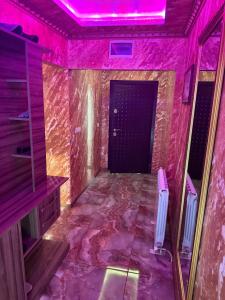 a room with a purple ceiling and a door at LADA Apartment in Nesebar