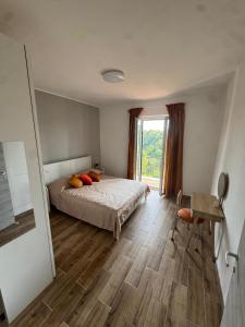 Ένα ή περισσότερα κρεβάτια σε δωμάτιο στο Veiotorome Casa Roma ad Isola Farnese