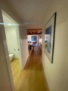 a hallway leading to a living room and a dining room at Hotel Apartamento Los Villares in Los Villares de Soria +9 photos