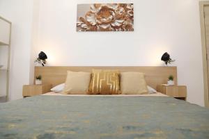 Postel nebo postele na pokoji v ubytování Modern 1 Bedroom Apartment at The Gallery, East Legon, Pool & Gym + 34 fotografií