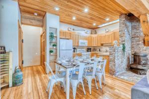 a kitchen and dining room with a table and chairs at Private Ranch 2BR Cabin Retreat Sleeps 9 in Anacortes