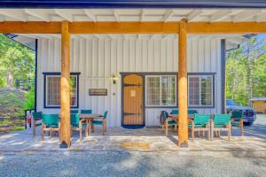 a porch with a table and chairs and a wooden door at Private Ranch 2BR Cabin Retreat Sleeps 9 in Anacortes +53 photos