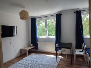 Un televizor și/sau centru de divertisment la Monteurwohnung Gera - L8 Street