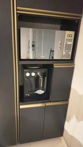 Kuchyň nebo kuchyňský kout v ubytování Lindo quarto a 8 min da praia