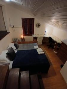 Ένα ή περισσότερα κρεβάτια σε δωμάτιο στο Refúgio Arioli
