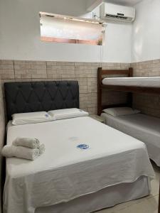 Cama ou camas em um quarto em Casas do Matteo - 2ª Praia