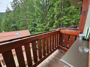 a wooden balcony with a view of the woods at Fatrapark 1 Apartments in Ružomberok +60 photos
