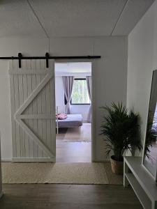 a sliding barn door in a room with a bedroom at Studio Ski Lodge in Rovaniemi