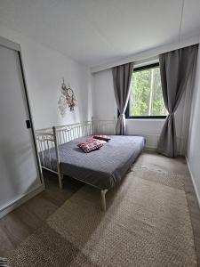 Ένα ή περισσότερα κρεβάτια σε δωμάτιο στο Studio Ski Lodge