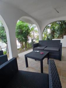 a living room with couches and a coffee table at MonaLiza in Ulcinj