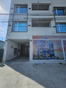 a building with a large advertisement on the side of it at Rincon de Mayo in Tandil