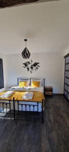 a bedroom with a bed and a chandelier at Rustik Home in Kotel +22 photos