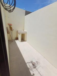 a bathroom with a sink in a white wall at Casa Sendero in Los Mochis