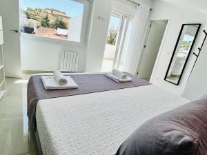 Katil atau katil-katil dalam bilik di Apartamentos Principado de Aracena +36 gambar