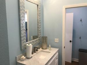 a bathroom with a sink and a mirror at Yoga Castia Complimentary Canoeing in Hot Springs +25 photos