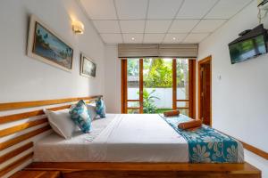 Postel nebo postele na pokoji v ubytování Ricco Tara + 19 fotografií