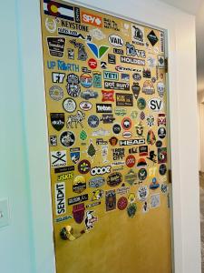 a door with lots of stickers on it at Modern 2BR Retreat in Harbor in Harbor Springs