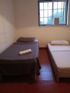 En eller flere senge i et værelse på Casa Ladino no Campo