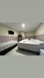 Ένα ή περισσότερα κρεβάτια σε δωμάτιο στο Center Prime Hotel