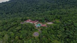 an aerial view of a house in the middle of a forest at Mata Atlântica Park Hotel in Matinhos