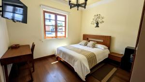 Postel nebo postele na pokoji v ubytování Habitaciones Deluxe La Casona de La Floresta + 11 fotografií