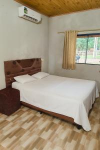 two beds sitting in a room with a window at Casa en Trinidad - Disponible para WRC in Trinidad