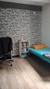 Giường trong phòng chung tại Vill'happy Martinique