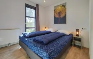 Ένα ή περισσότερα κρεβάτια σε δωμάτιο στο Gorgeous Home In Nijkerk With Wifi +21 φωτογραφίες