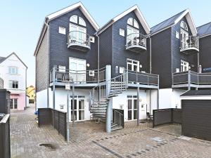 a building with a spiral staircase on the side of it at Central Oasis in Lokken - By Traum Ferienwohnungen in Løkken
