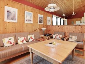 a living room with a couch and a table at Luxury Retreat in Blavand - By Traum Ferienwohnungen in Blåvand