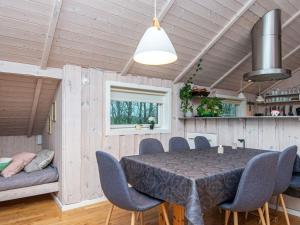 a dining room with a table and chairs at 6 person holiday home in Sydals-By Traum in Neder Lysabild