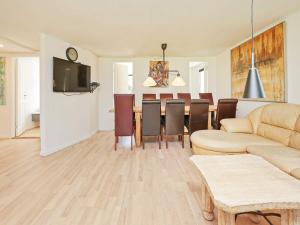 a living room with a couch and a table at 10 person holiday home in Dragør-By Traum in Dragør