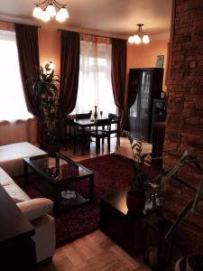 a living room with a couch and a table at Luxury Dana's City Centre Apartment in Kaunas