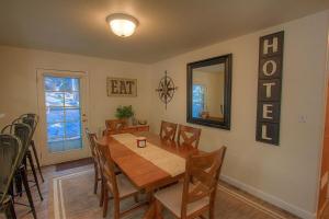 a dining room with a wooden table and chairs at NVH0823 - Sadies Hustle home in Zephyr Cove