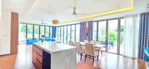a large living room with a table and chairs at Danang Villas Complex in Da Nang +151 photos