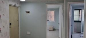 a hallway of a room with a white wall at Shanel House in Incheon +25 photos