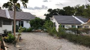 a house with solar panels on the roof at Caliph Homestay in Jitra