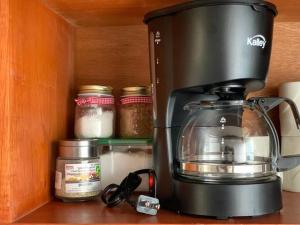 a coffee maker sitting on top of a kitchen counter at A COSTA Da ROCK in Santa Marta