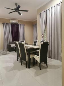 a dining room with a table and chairs at Homestay Azkha in Langkawi Islands +20 photos