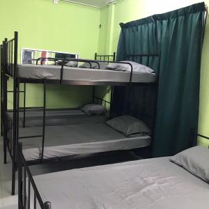 a couple of bunk beds in a room at D'Pantai Bari Indah campsite & resort in Setiu +32 photos