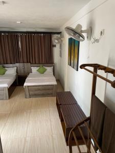 Una cama o camas en una habitación de Ella Always Welcome Resort