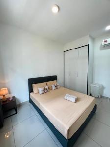 a bedroom with a large bed in a room at Latte Homestay Desaru 5GWifi with Swimming Pool in Bandar Penawar +19 photos
