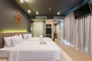 Postel nebo postele na pokoji v ubytování Maya Phuket Airport Hotel-Naiyang Beach