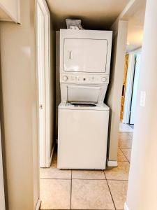 a white washer and dryer in a room at Route 66 Hope Ranch House in Kingman