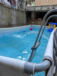 a swimming pool with a ball in the water at דירת חדר זוגית in Safed +1 photo